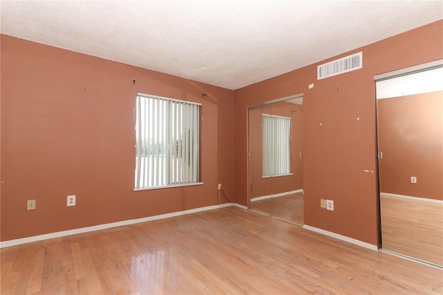 626 Orange Dr Unit 242, Altamonte Springs, FL 32701 - empty room featuring light hardwood / wood-style flooring and a textured ceiling