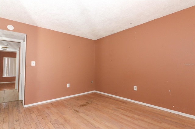 626 Orange Dr Unit 242, Altamonte Springs, FL 32701 - spare room with light hardwood / wood-style flooring and a textured ceiling