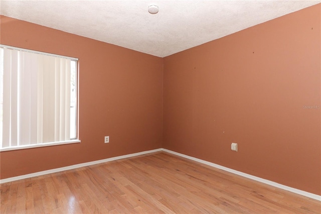 626 Orange Dr Unit 242, Altamonte Springs, FL 32701 - unfurnished room with hardwood / wood-style floors and a textured ceiling