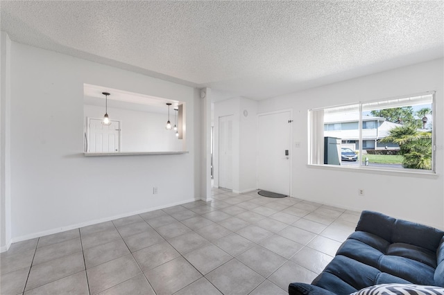 unfurnished living room with a textured ceiling