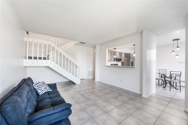 living room with a textured ceiling