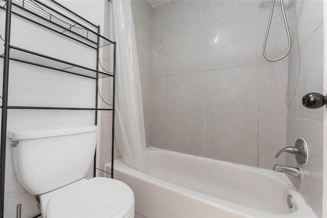 bathroom featuring toilet and shower / bath combo with shower curtain