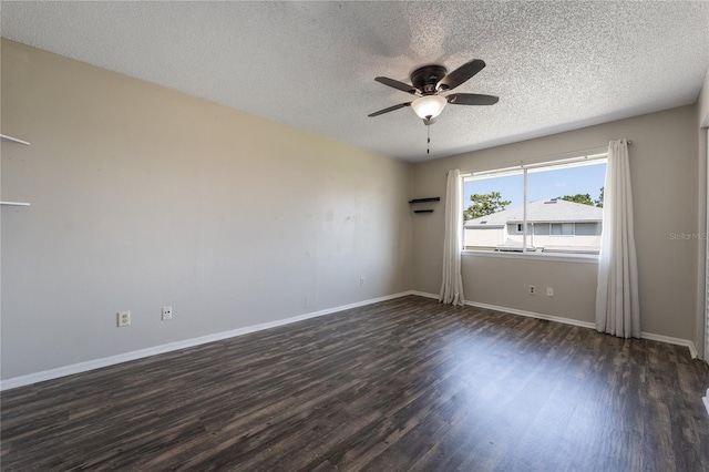 spare room featuring dark hardwood / wood-style floors, a textured ceiling, and ceiling fan