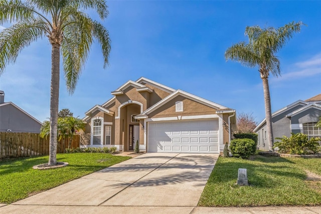 view of front of house with a garage and a front yard