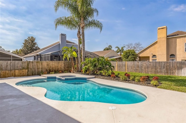 view of swimming pool with a patio area and an in ground hot tub