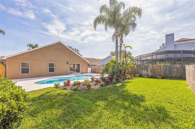 view of pool featuring a yard and a patio area