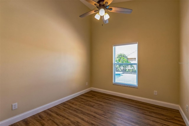 unfurnished room with ceiling fan and dark hardwood / wood-style flooring