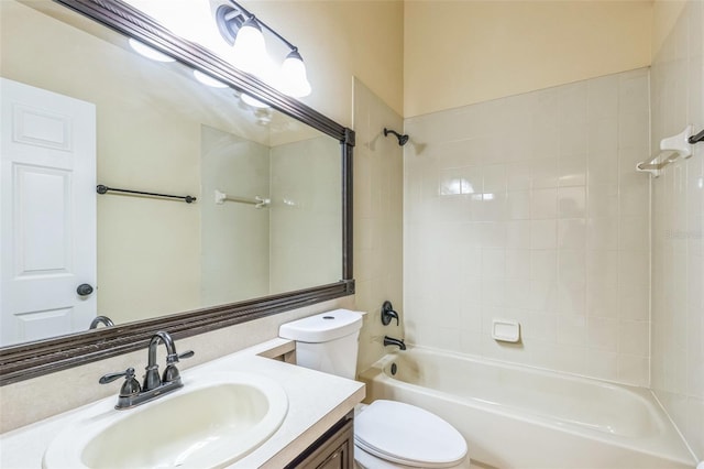 full bathroom with tiled shower / bath combo, vanity, and toilet