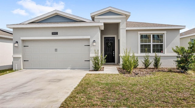 view of front of property with a garage and a front yard