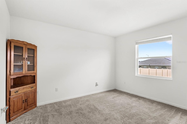 unfurnished room with carpet flooring
