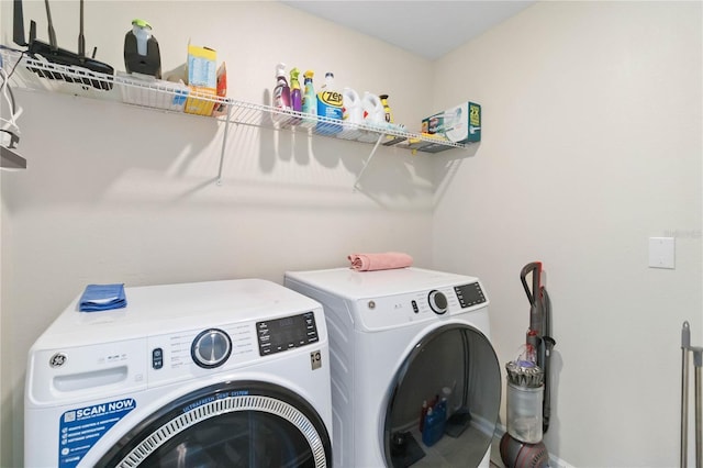 laundry room with washing machine and clothes dryer