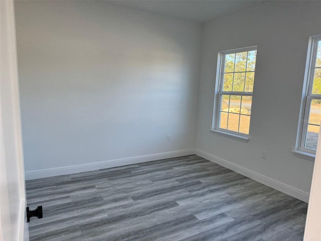 spare room featuring dark hardwood / wood-style floors