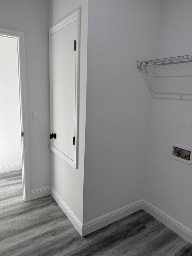 laundry room with hookup for a washing machine and wood-type flooring