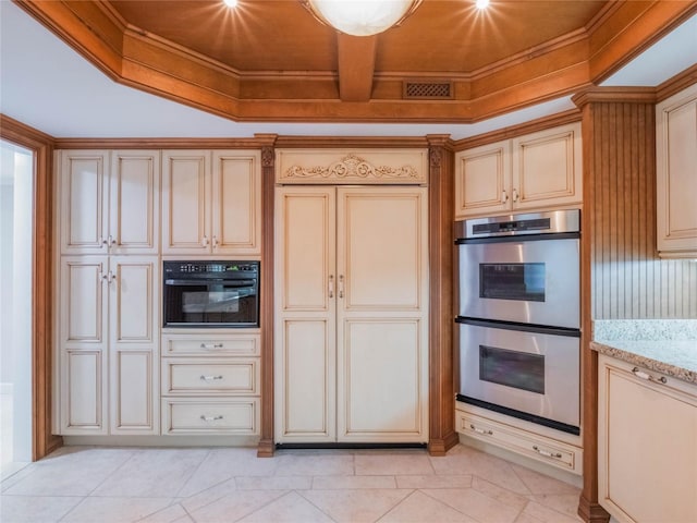 kitchen with crown molding, light tile patterned floors, stainless steel double oven, and light stone countertops