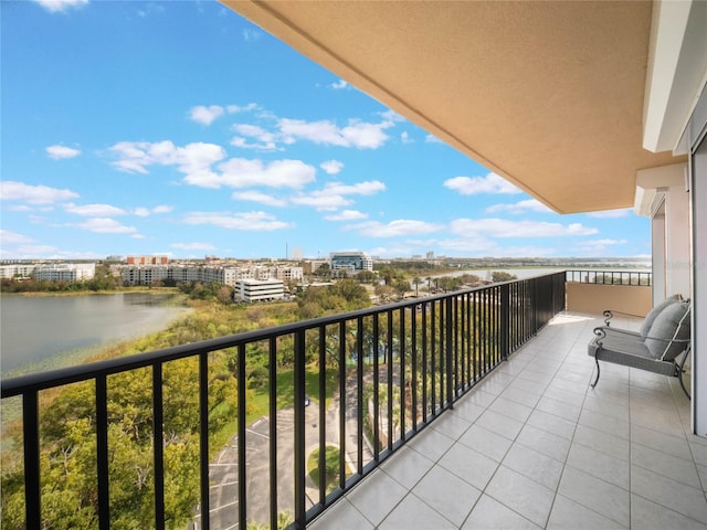 balcony featuring a water view