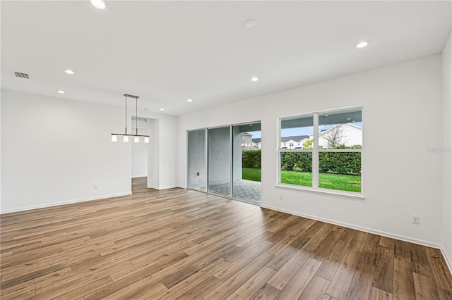 unfurnished living room featuring recessed lighting, visible vents, and light wood-style floors