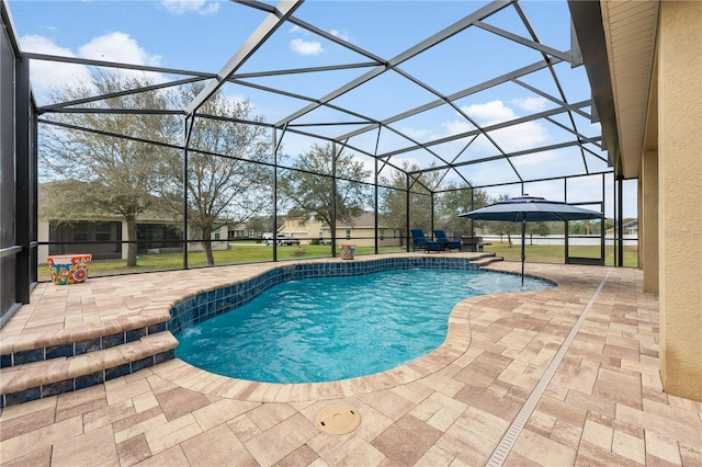 pool with a patio, a yard, and a lanai