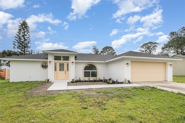 view of front of house with a garage and a front yard