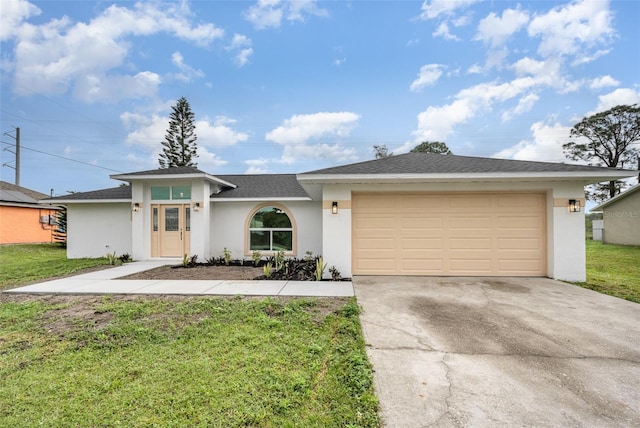 ranch-style home featuring a garage and a front lawn