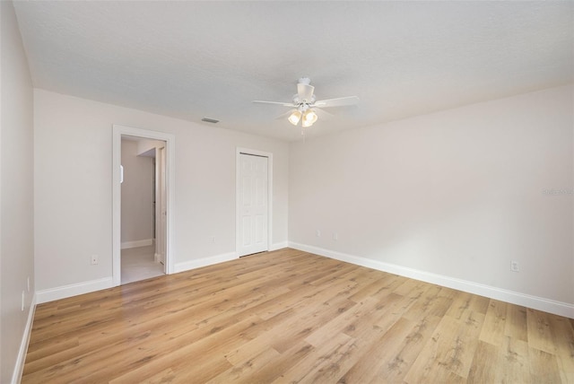 1001 Glencove Ave NW, Palm Bay, FL 32907 - unfurnished bedroom with baseboards and light wood-style floors