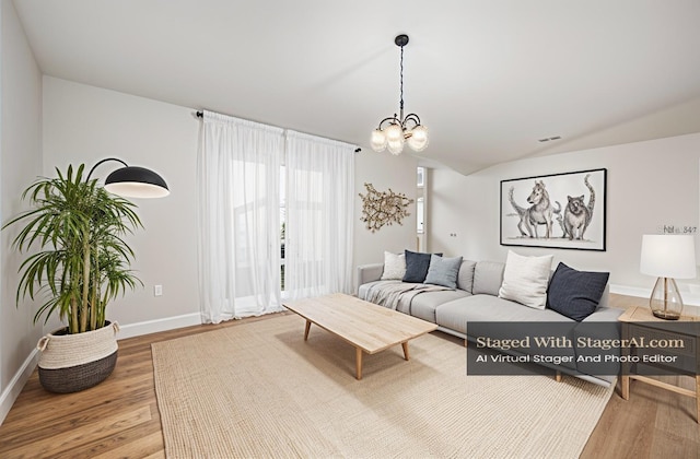 1001 Glencove Ave NW, Palm Bay, FL 32907 - living room with vaulted ceiling, a notable chandelier, wood finished floors, and baseboards