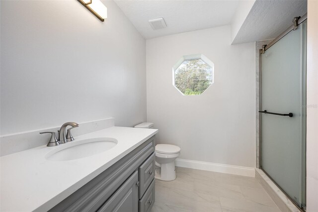 1001 Glencove Ave NW, Palm Bay, FL 32907 - full bathroom with marble finish floor, a shower with door, toilet, vanity, and baseboards