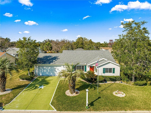 ranch-style house with a garage and a front lawn