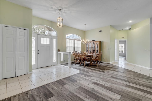 foyer featuring light hardwood / wood-style floors and a chandelier