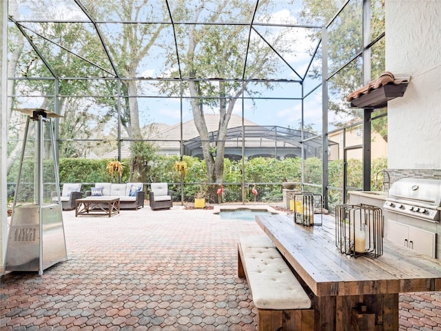 view of patio with an outdoor hangout area, grilling area, and glass enclosure