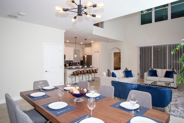 dining room featuring baseboards, recessed lighting, visible vents, and an inviting chandelier