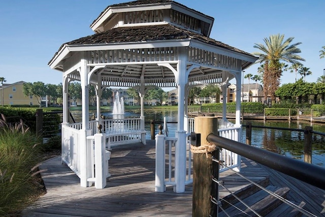 dock area with a gazebo and a water view