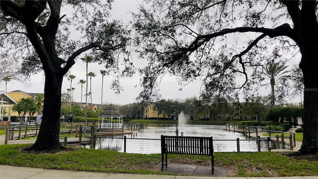 view of community with a gazebo and a water view