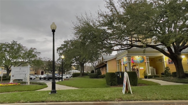 view of home's community featuring a lawn