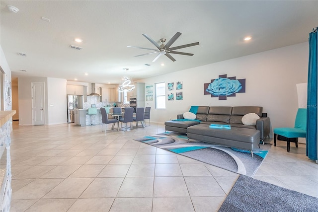 tiled living room featuring ceiling fan