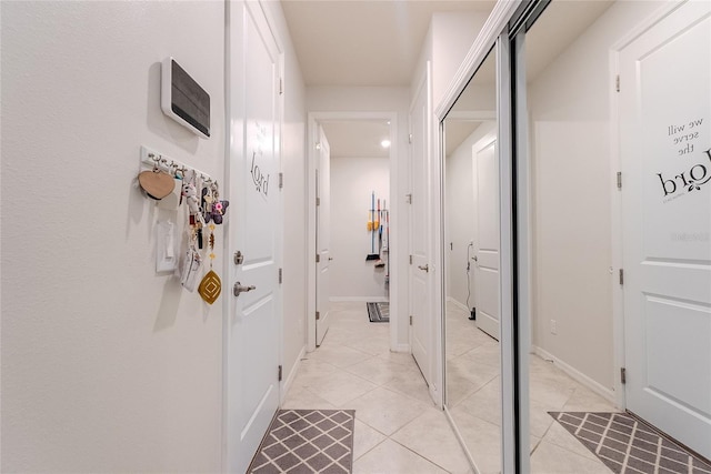 hallway with light tile patterned floors