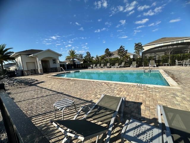 view of swimming pool with a patio area