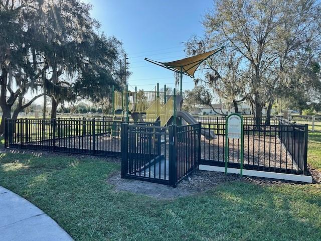 view of gate featuring a yard