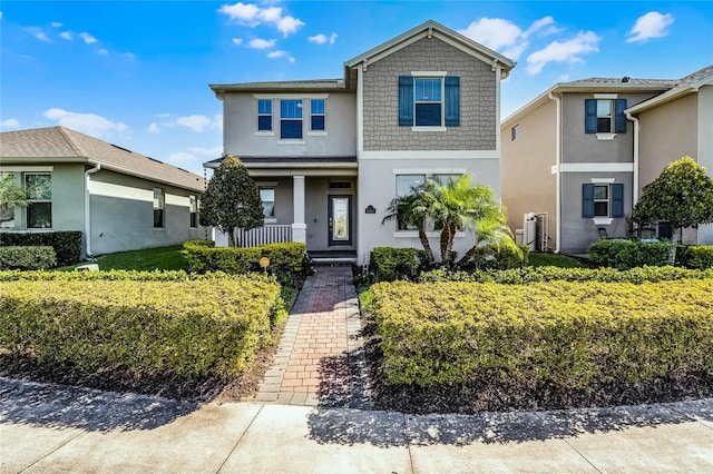 view of front of property with a porch and stucco siding