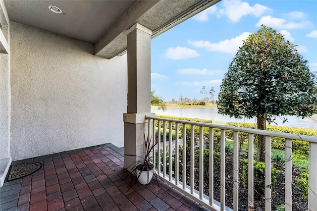 balcony featuring a water view