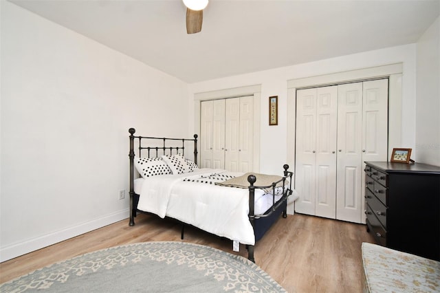 1611 Chestnut Ave, Winter Park, FL 32789 - bedroom featuring two closets, wood finished floors, baseboards, and ceiling fan