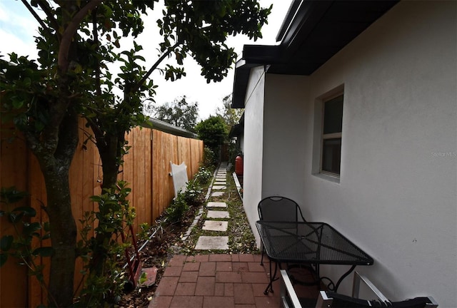 1611 Chestnut Ave, Winter Park, FL 32789 - view of side of property featuring stucco siding and a patio area