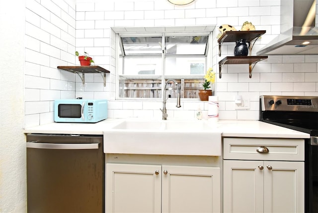 1611 Chestnut Ave, Winter Park, FL 32789 - kitchen featuring open shelves, stainless steel appliances, decorative backsplash, wall chimney exhaust hood, and a sink