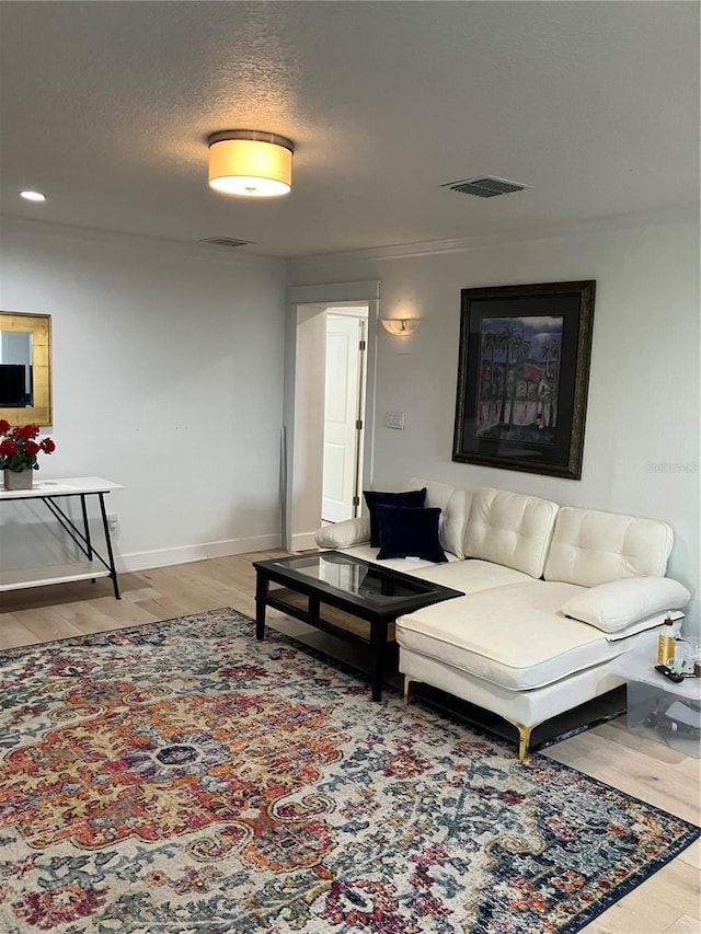 1611 Chestnut Ave, Winter Park, FL 32789 - living area with light wood-type flooring, baseboards, recessed lighting, and crown molding