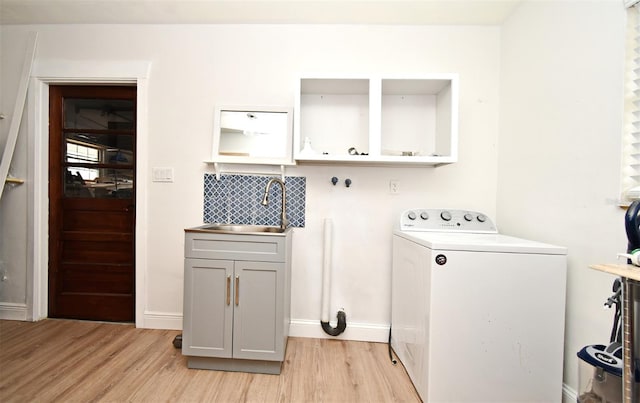 1611 Chestnut Ave, Winter Park, FL 32789 - washroom with washer / clothes dryer, light wood finished floors, cabinet space, and baseboards