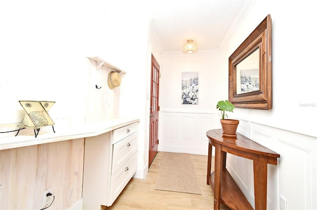 1611 Chestnut Ave, Winter Park, FL 32789 - hallway featuring crown molding, light wood-style floors, and wainscoting