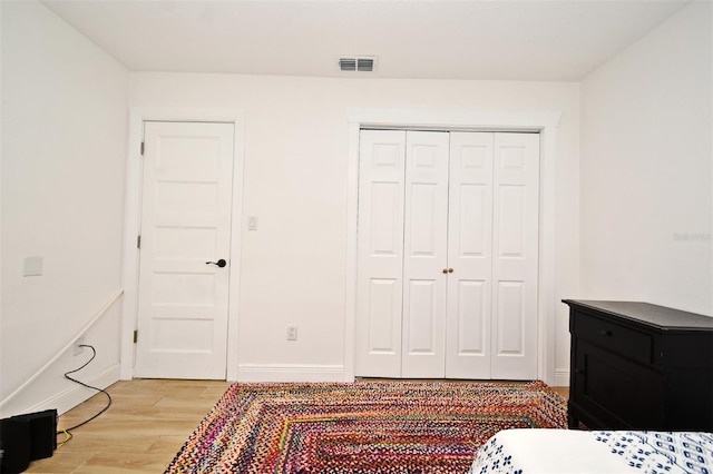 1611 Chestnut Ave, Winter Park, FL 32789 - bedroom featuring light wood-style flooring, a closet, and baseboards