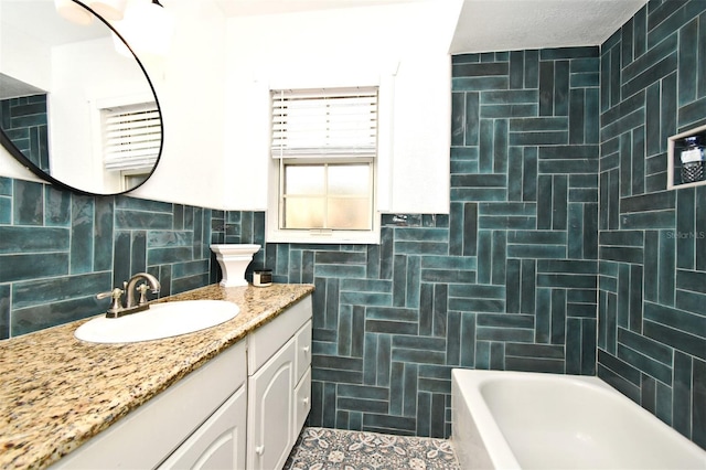 1611 Chestnut Ave, Winter Park, FL 32789 - full bathroom with tile walls and vanity