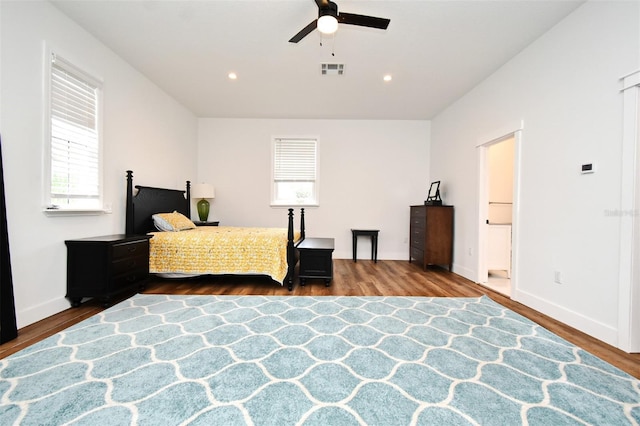1611 Chestnut Ave, Winter Park, FL 32789 - bedroom with wood finished floors, multiple windows, baseboards, and recessed lighting