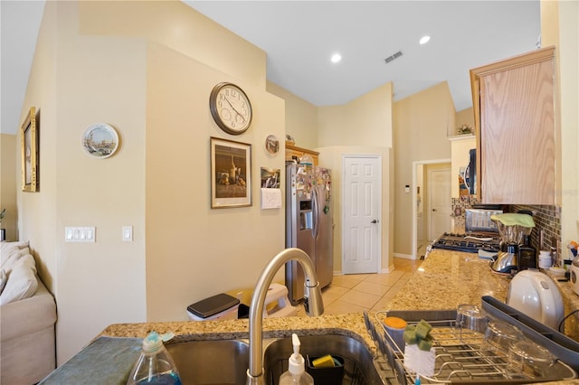 kitchen featuring visible vents, recessed lighting, light tile patterned flooring, stainless steel appliances, and a sink