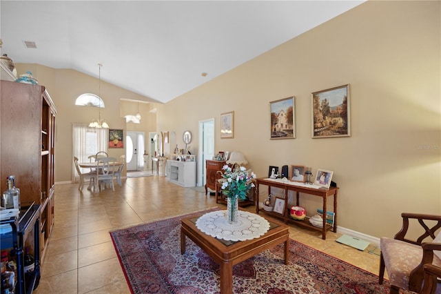 living room with baseboards, visible vents, high vaulted ceiling, an inviting chandelier, and light tile patterned flooring